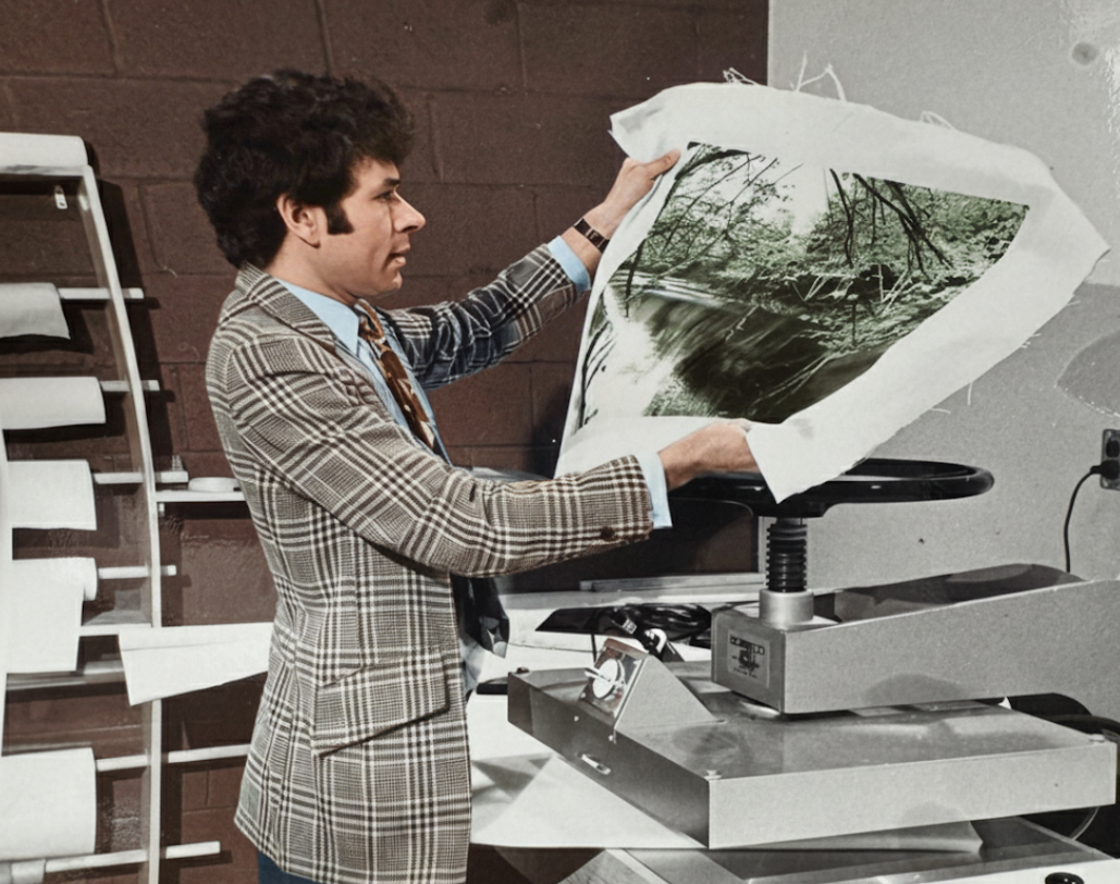 Drytac founder Richard Kelley with a dry mounting press